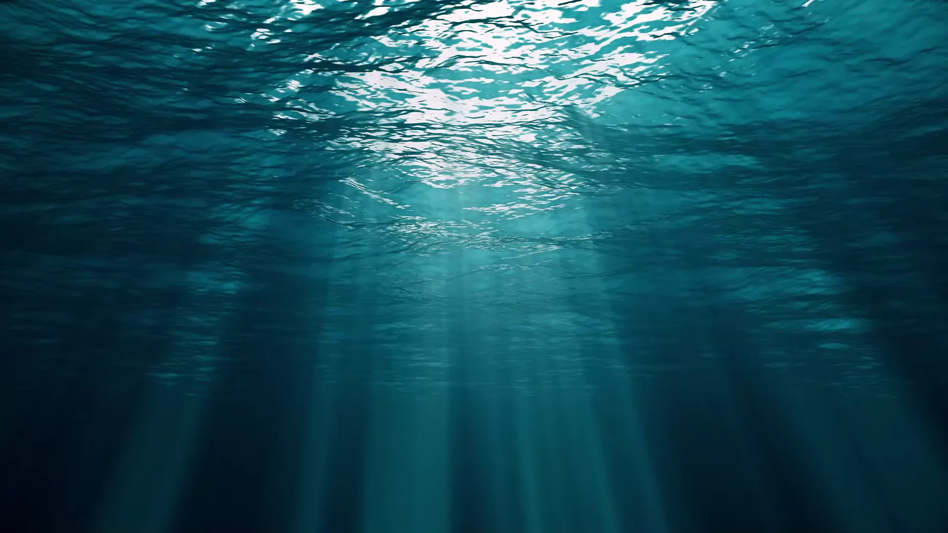 Raios de luz atravessando a água do oceano
